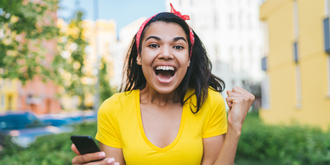Woman smiling and celebrating because she is a winner of FSCB Grand Giveaways