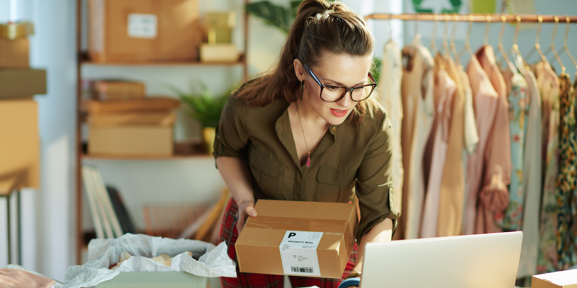 Female business owner learning how to improve her business finances in her shop