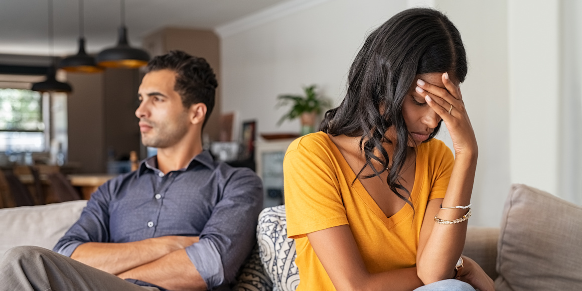 Young couple upset after an argument, demonstrating the important connection between money and relationships